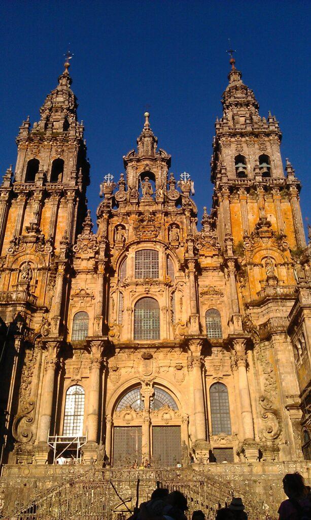 looking up at the cathedral de compostela in Santiago at dusk