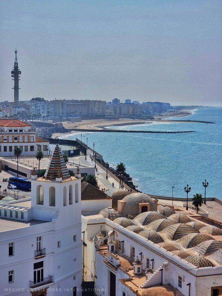 view from cathedral over buildings to beaches