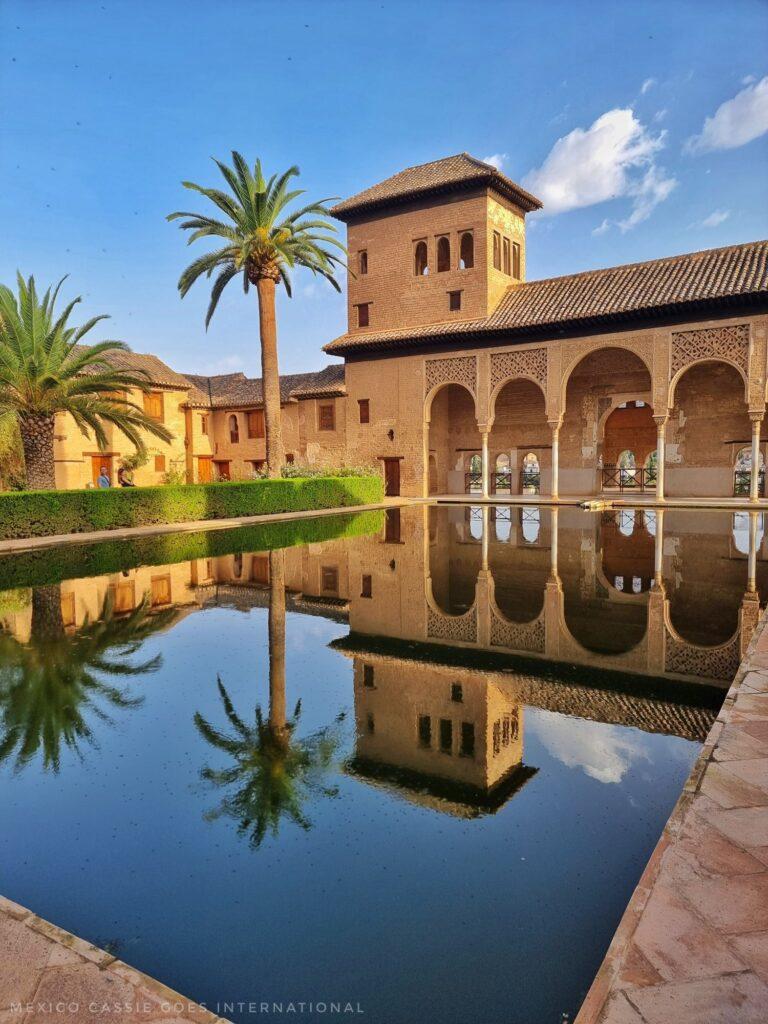 gorgeous palace building with reflection in the still water in front of it