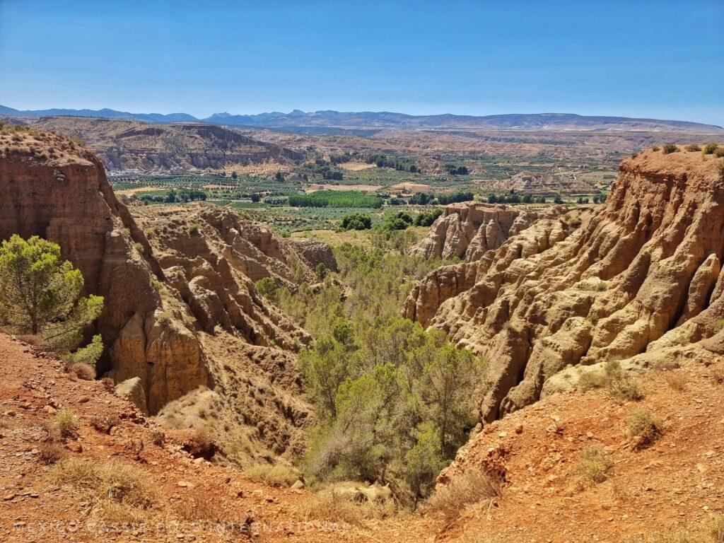 view over badlands near guadix - looking into a valley from above