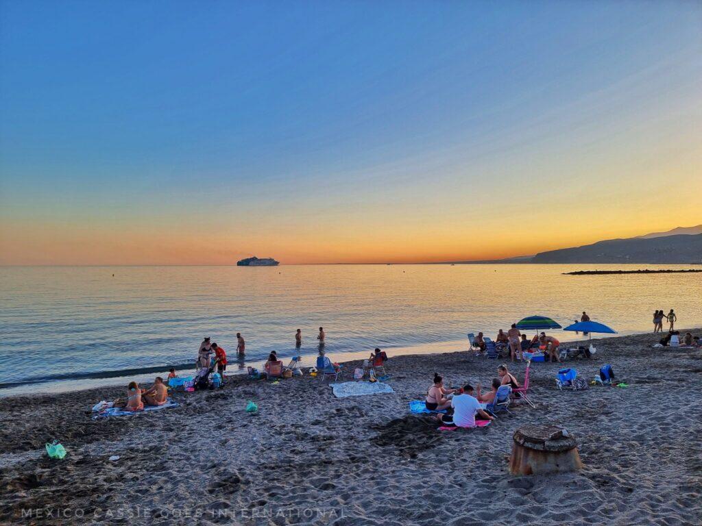 beach at sunset - families still sitting around