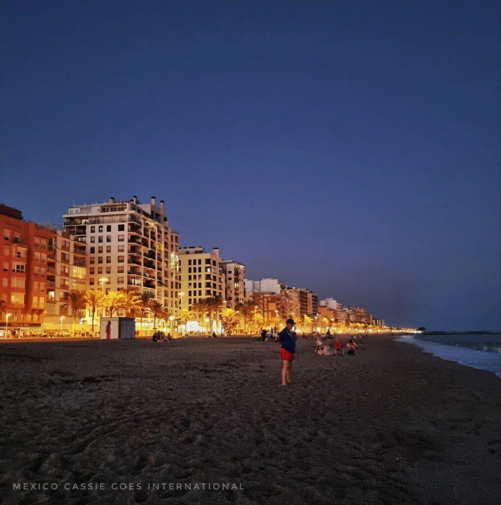 night view of an urban beach - lit up promenade