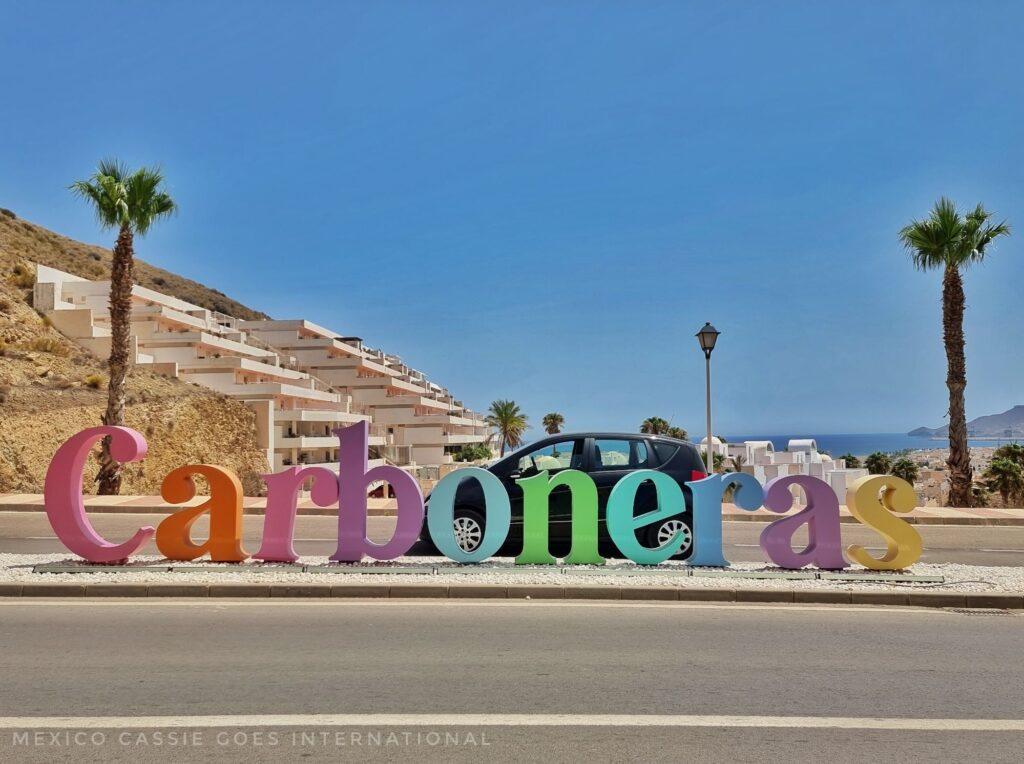 Carboneras sign on side of road (coloured brightly)