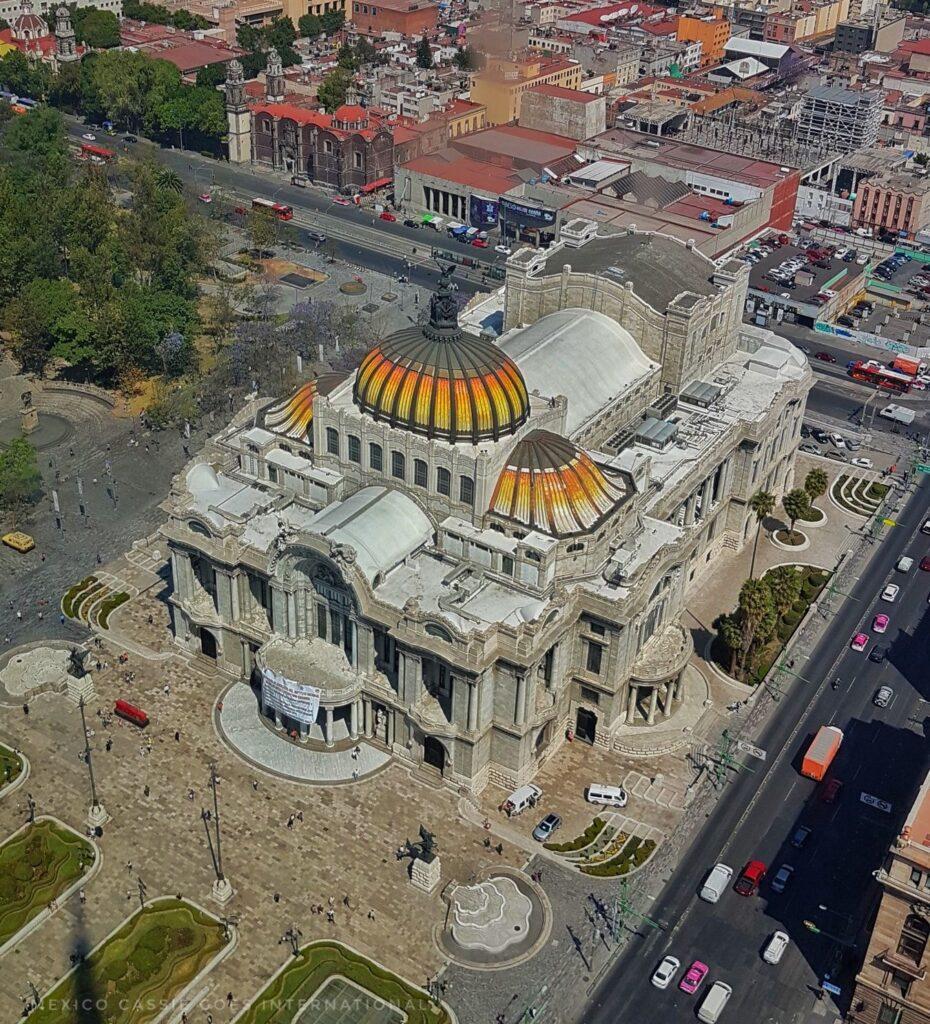 looking down on the museo de bellas artes - large building with orange/yellow domes