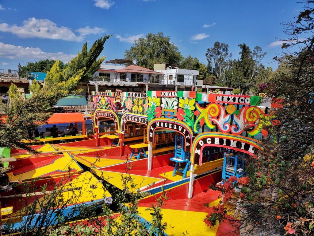 red and yellow barges with colourful coverings