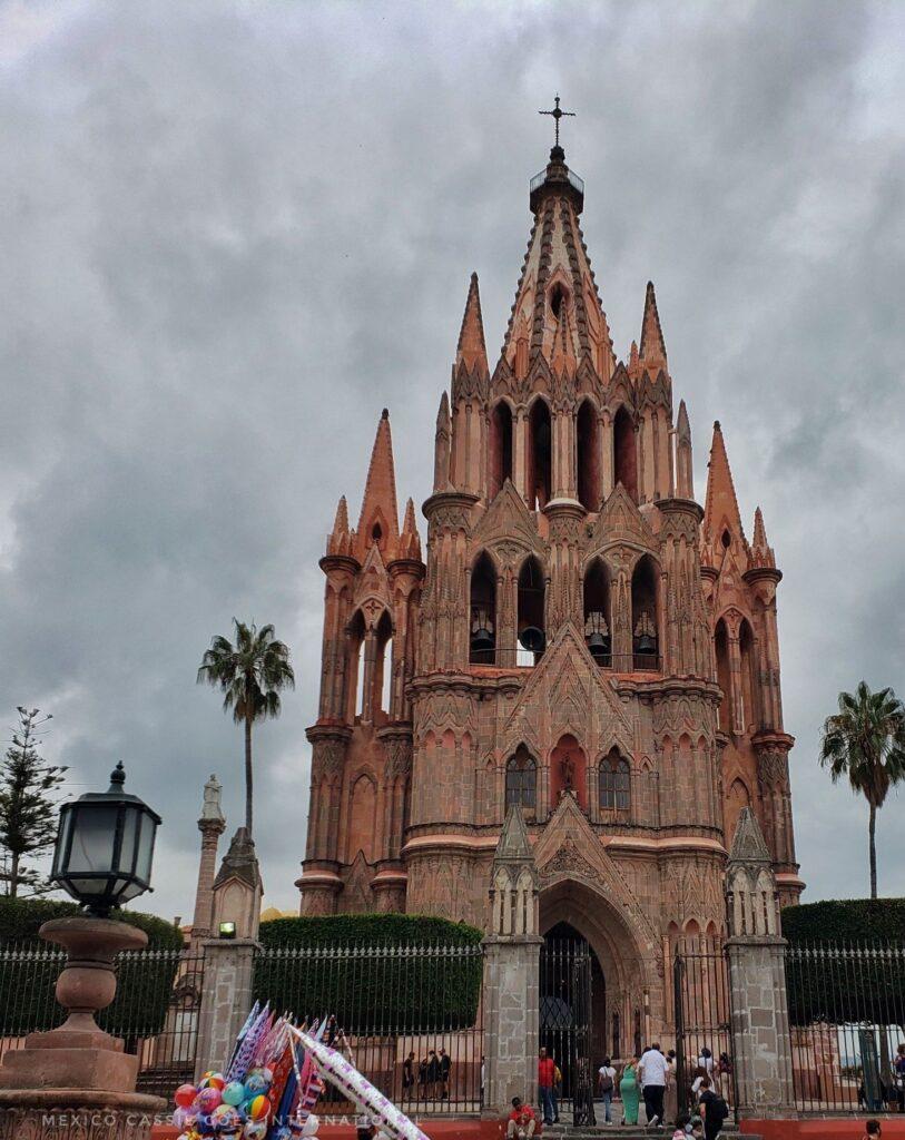 san miguel de allende's famous church on a grey day