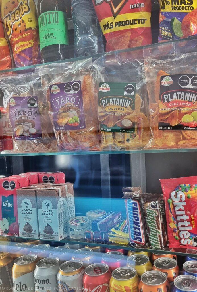snacks and drinks on display on a train