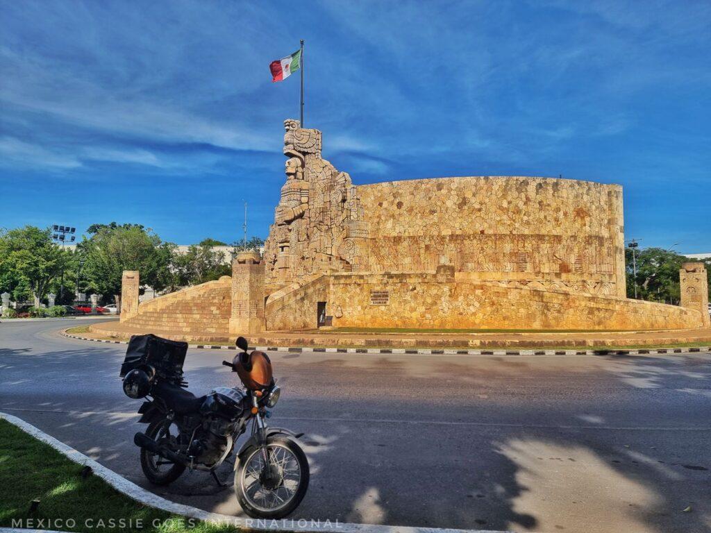 Mérida's most famous roundabout with flag flying. motorbike in front