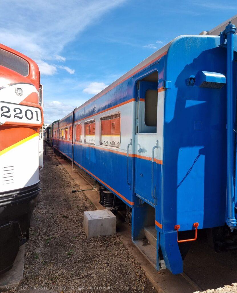 2 refurbished trains. orange on left, blue on right