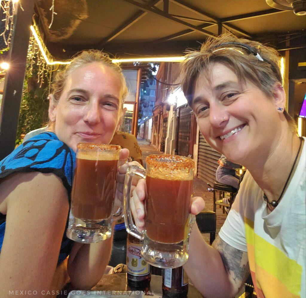 Cassie and Cordelia with beers