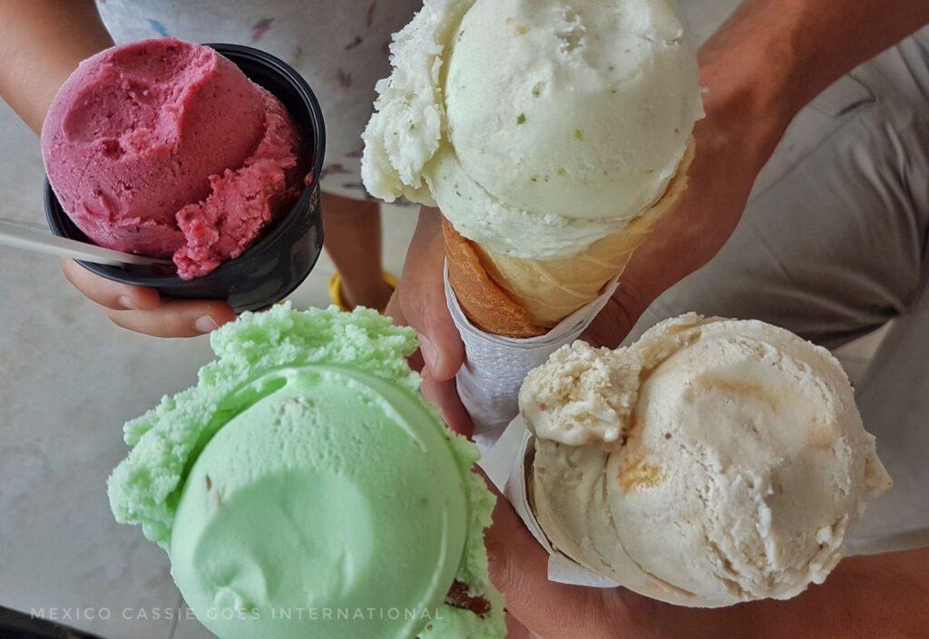 4 ice creams - one green, one pinkish & 2 creamy- photo taken from above