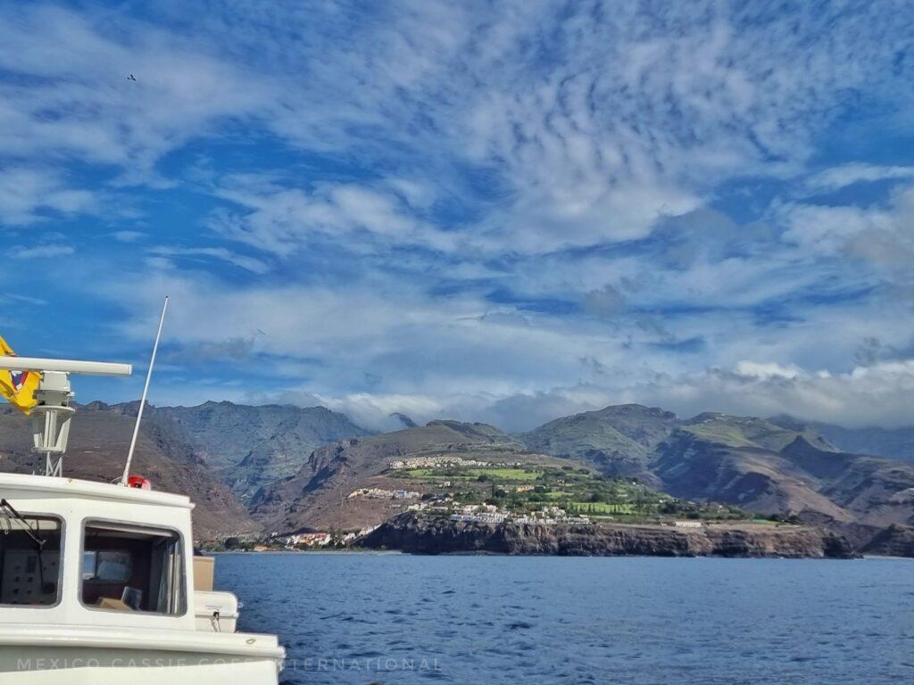 view of La Gomera from a boat (you can see part of the white boat in the bottom left corner of the photo)