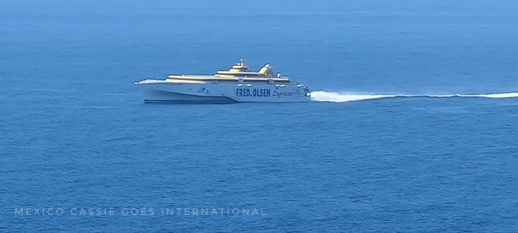 Fred Oslen express ferry moving through blue ocean