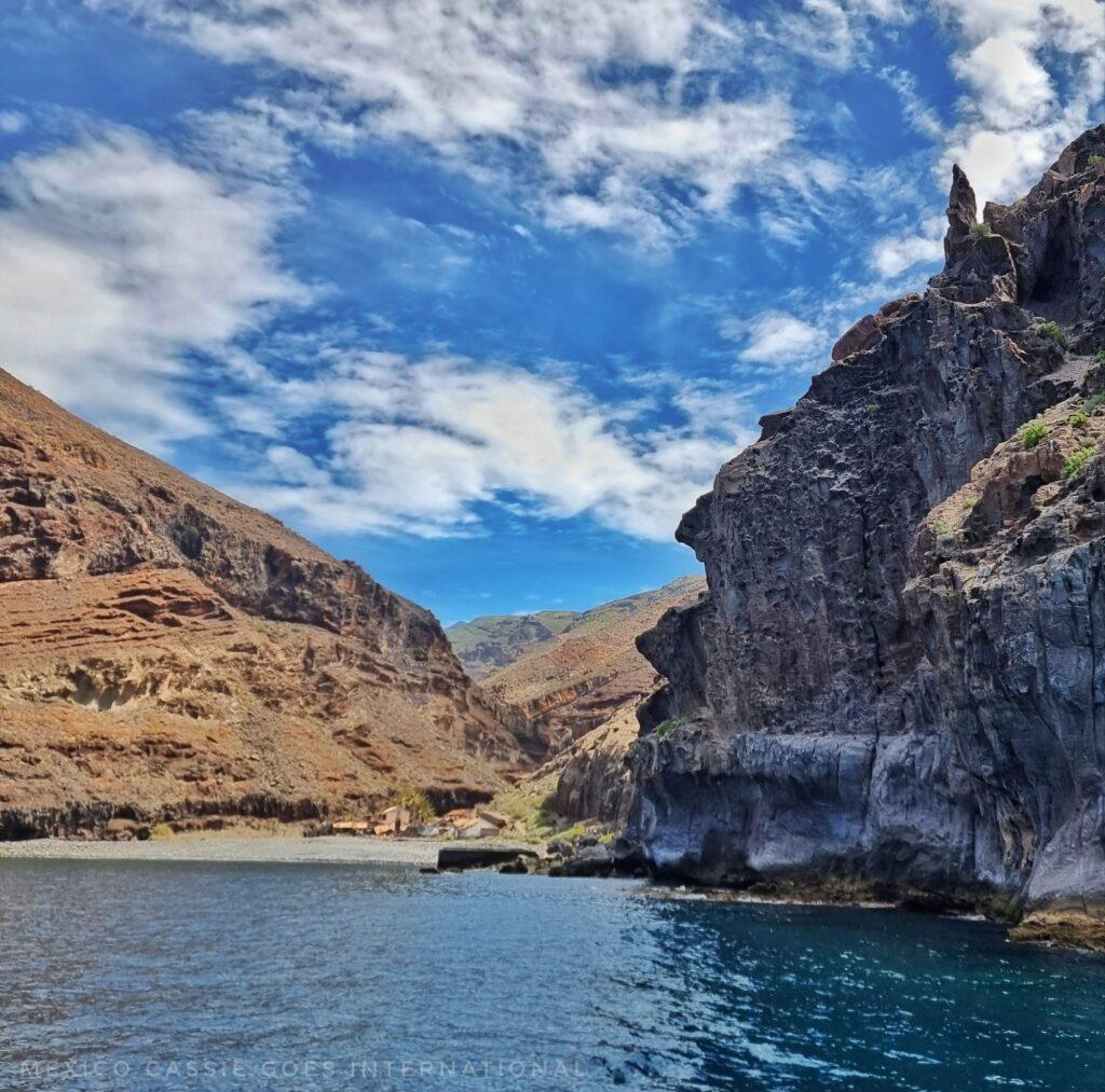 shot of small beach with cliffs on either side