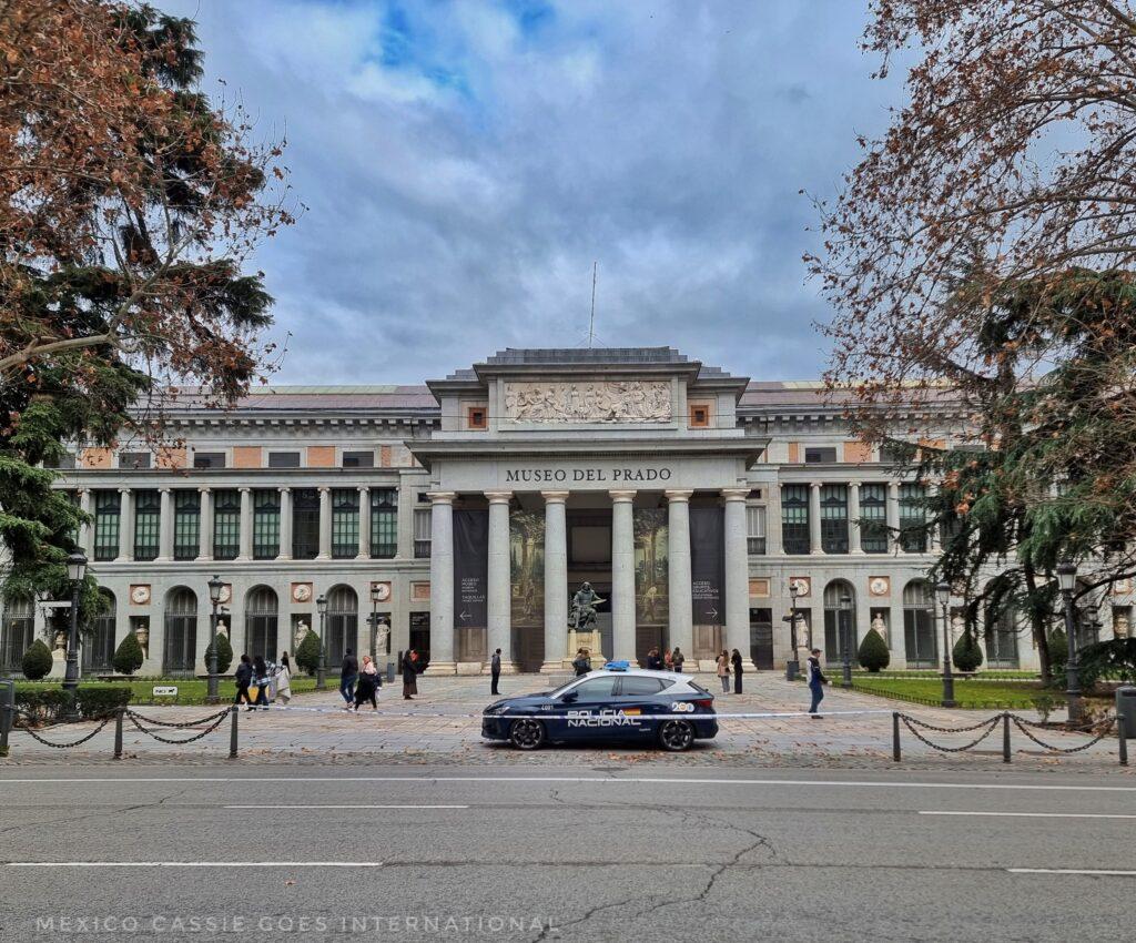 The Prado main entrance,  imposing columns, police car in front