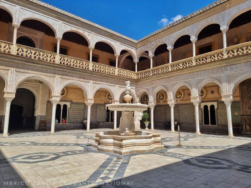 courtyard of casa de pilatos - delicate archways around courtyard, fountain in the middle