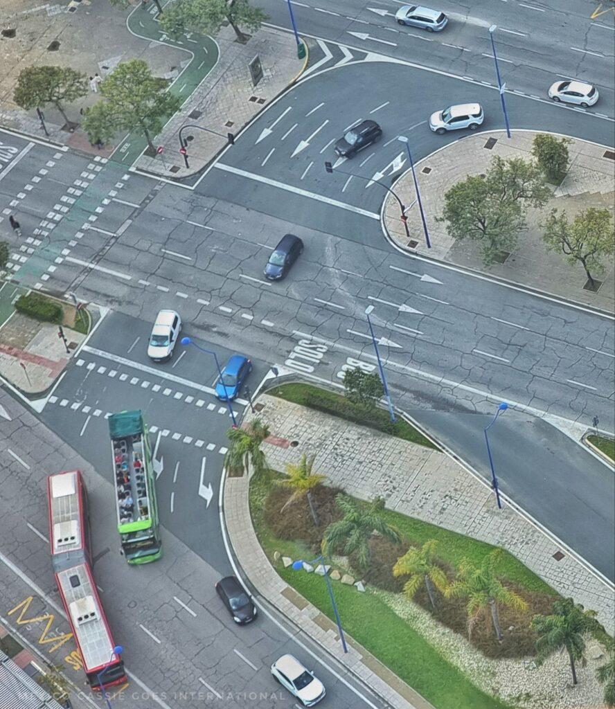 looking down on a roundabout from a mirador - can see buses and cars on the road