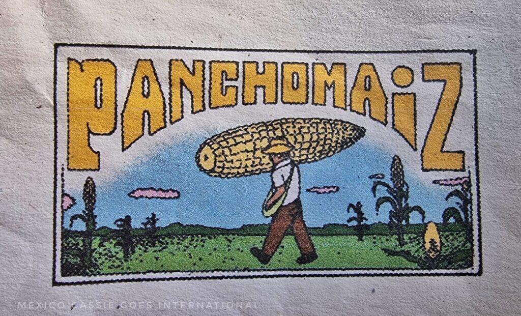 pancho maiz written in yellow around a picture of a man holding a giant corn