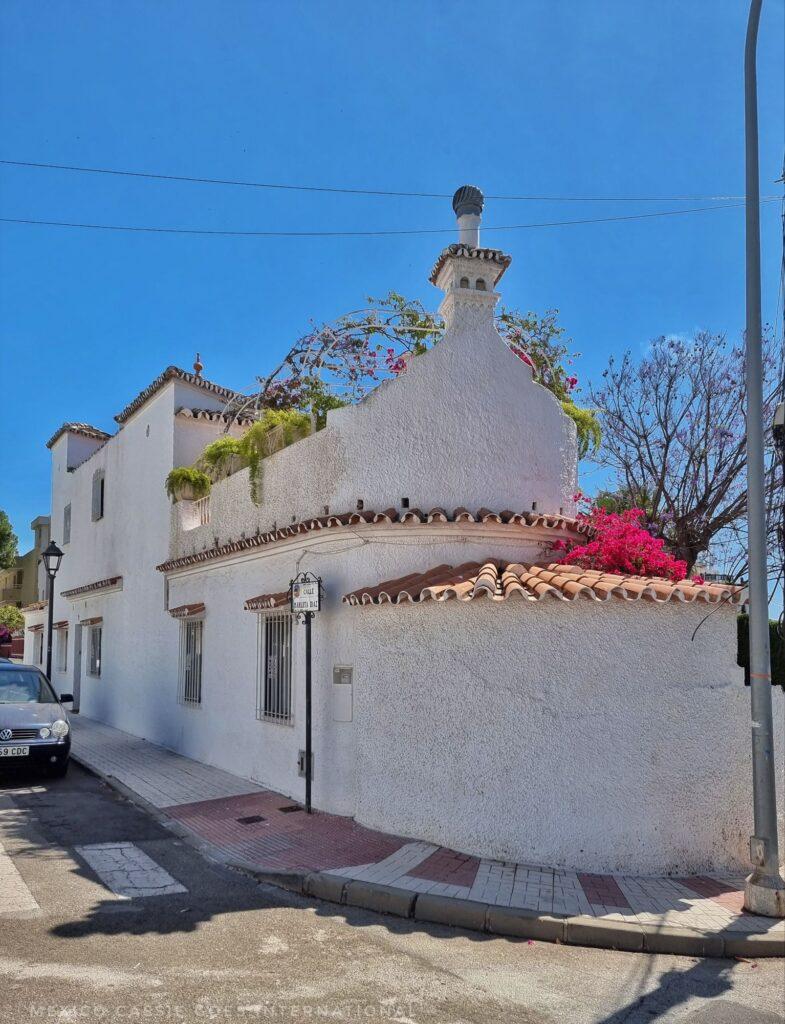 white traditional building on a corner