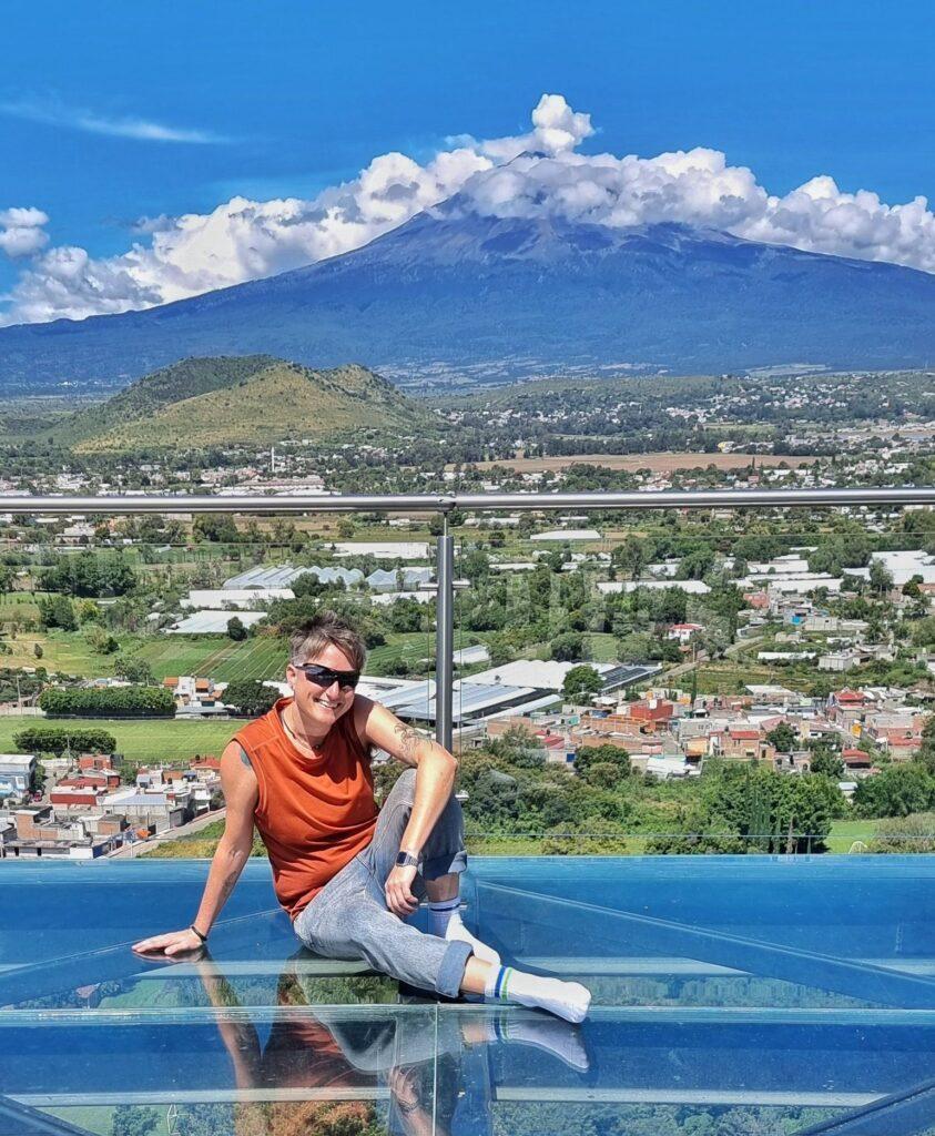 Cass sitting in front of view of volcano