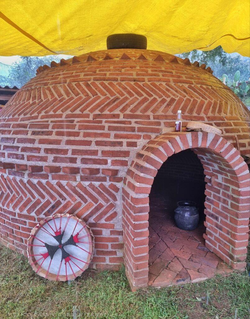 brick built temazcal (small round building with entrace you need to crawl through to get in)