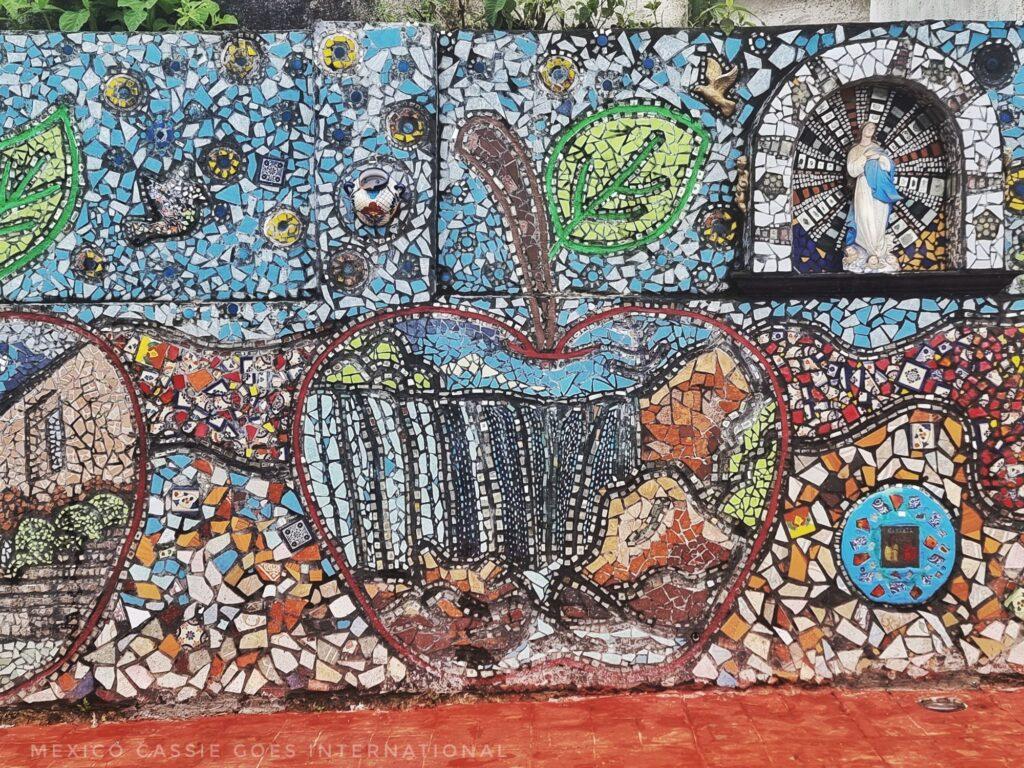 close up of a mosaic  - apple with view of waterfall within it
