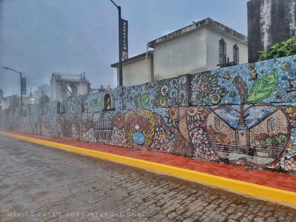 scene looking along the wall of mosaics, fog starts to obscure view