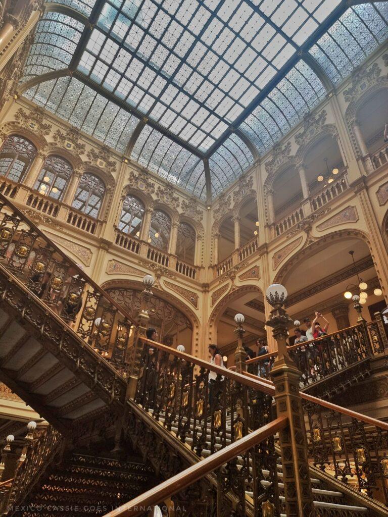 imposing staircases, columned windows and glass roof over the atrium