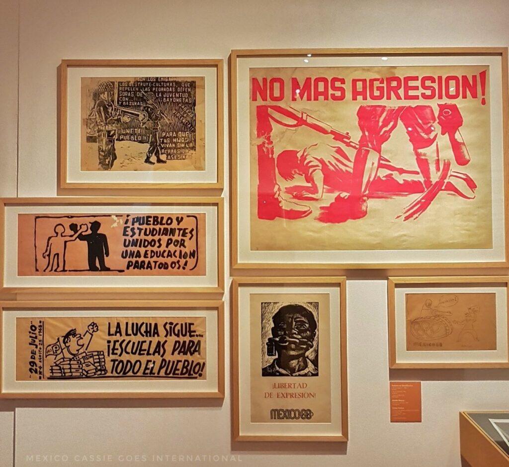 collection of framed pieces of art work on a white wall