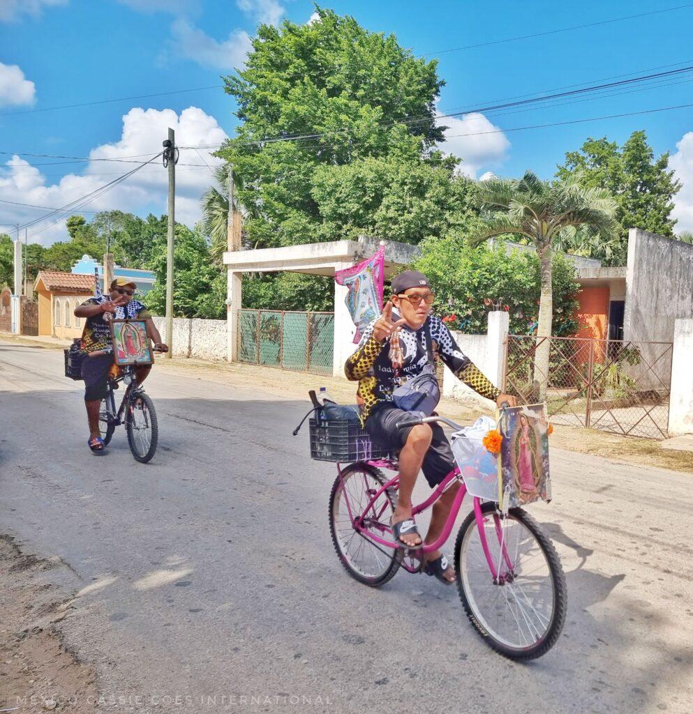 2 men on bikes for the virgen de guadalupe celebration