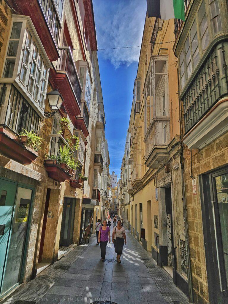 beautiful streets of cadiz, people walking, blue sky