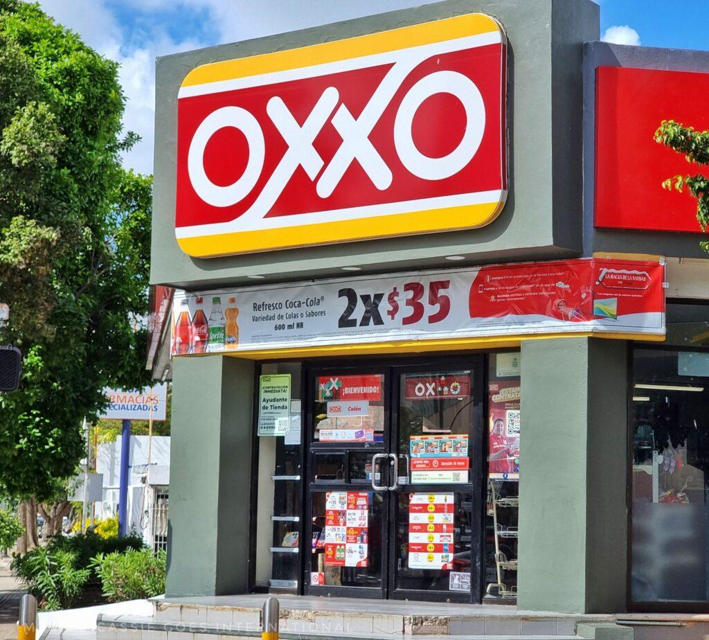 OXXO store front (OXXO written in white writing on red background. 