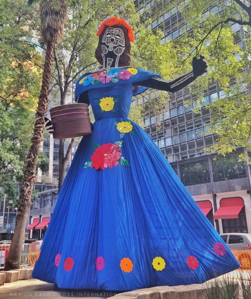 huge catrina in a blue dress