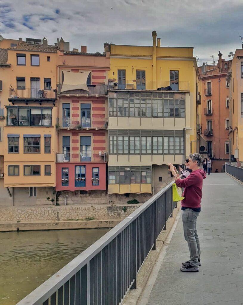 Cass on a bridge taking a photo