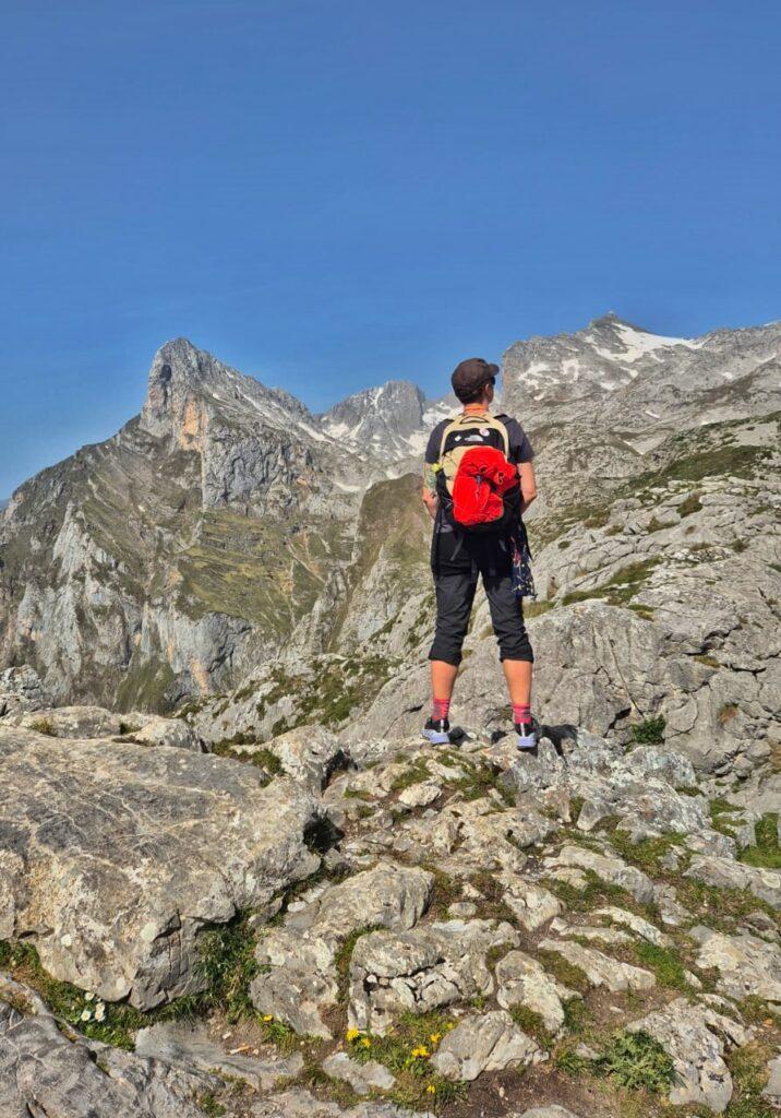 Cass facing away from camera looking out over mountains