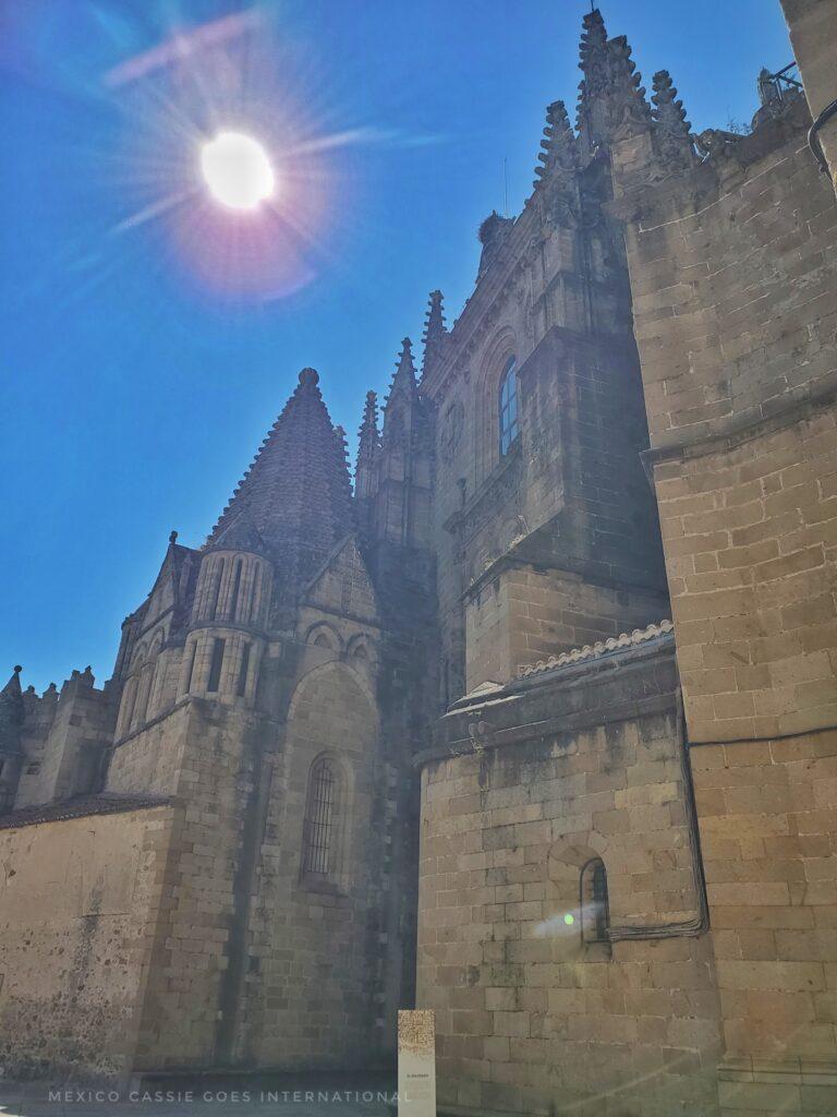 outside of large cathedral, sun shining directly down