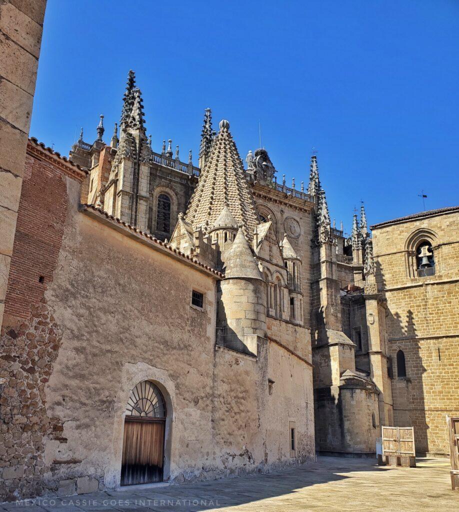 view from outside of a cathedral, large, imposing, turrets, blue sky