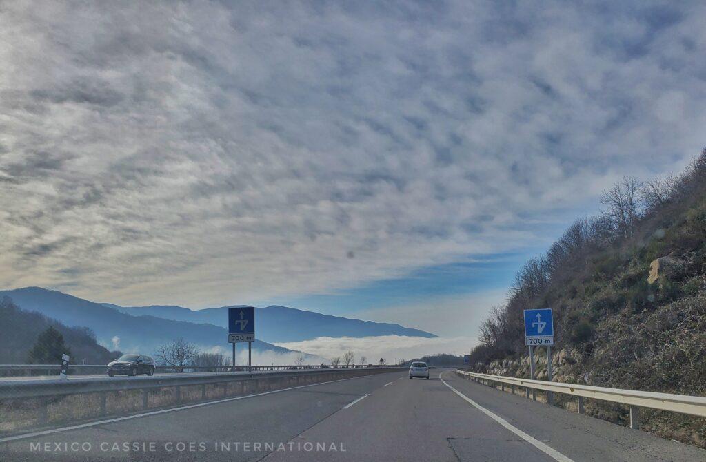 empty road with cloudy sky