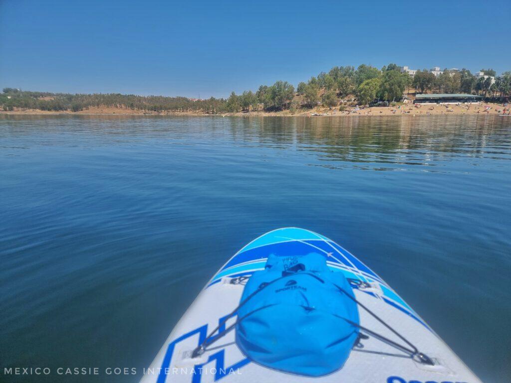 front of a paddle board on the water, land in front
