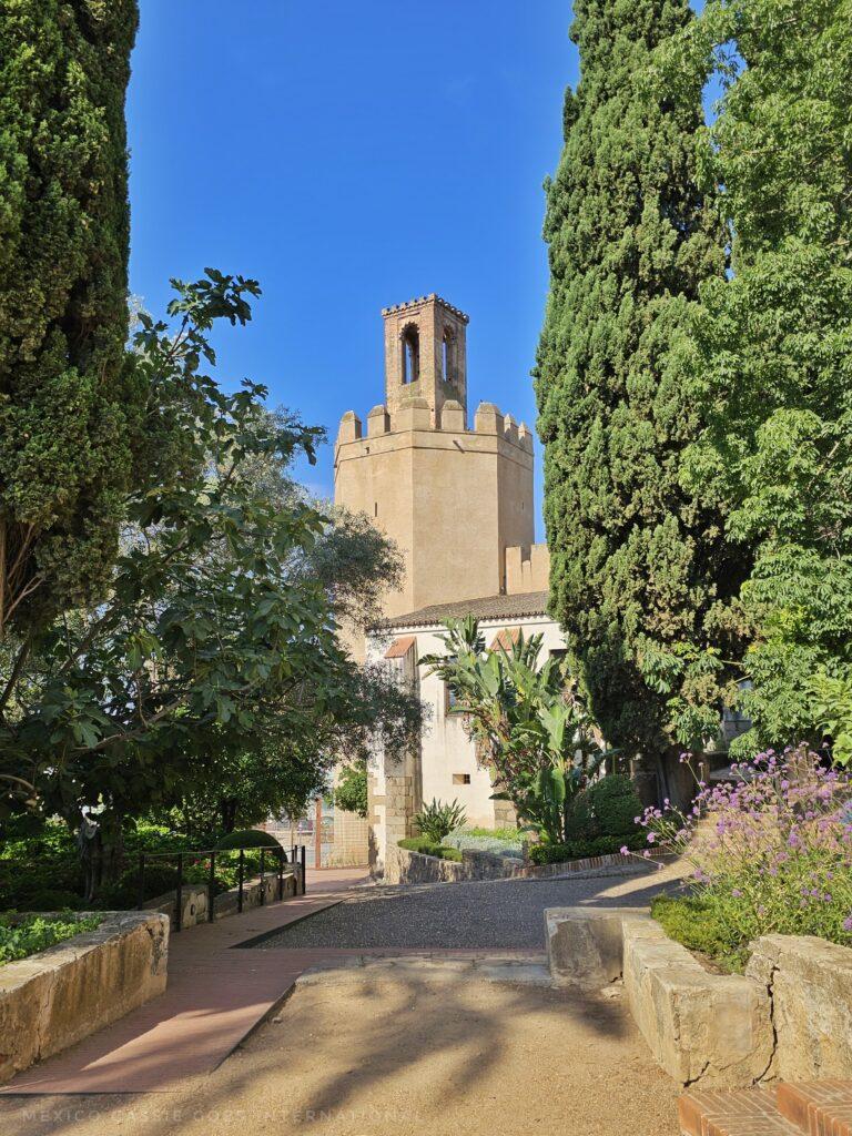 view of the eight sided tower through trees
