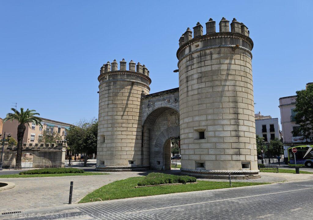 puerta de palmas - an imposing city gate with a tower on each side, blue sky