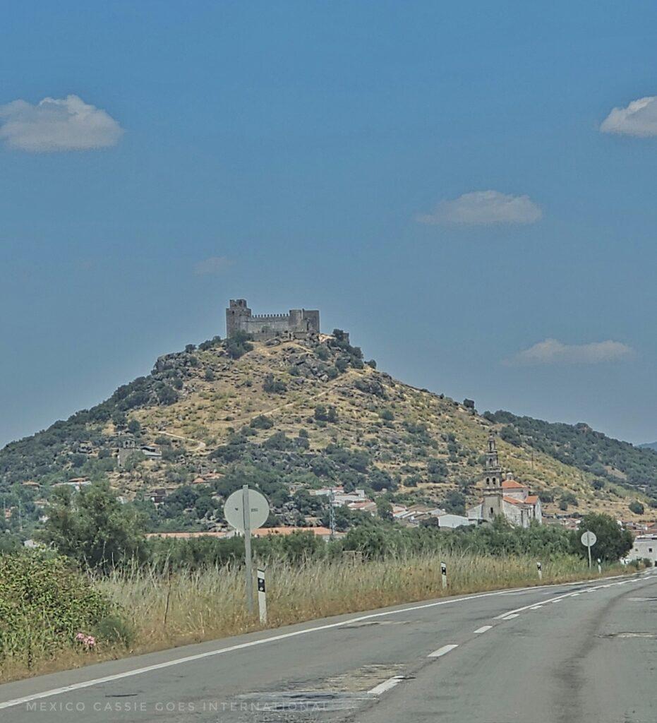 castle high up on hill, blue sky