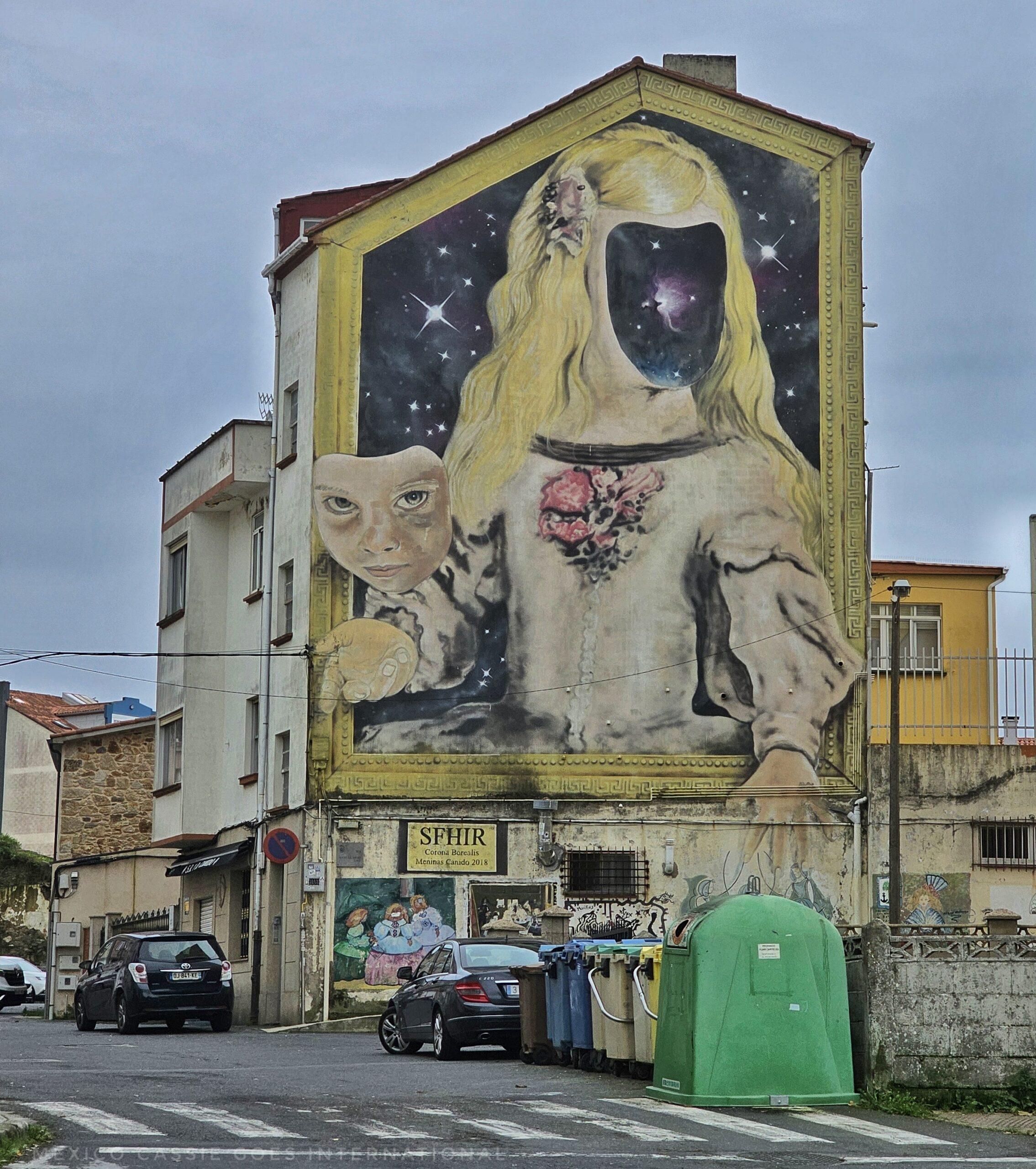 large street art of a girl in with an astronaut helmet as her head