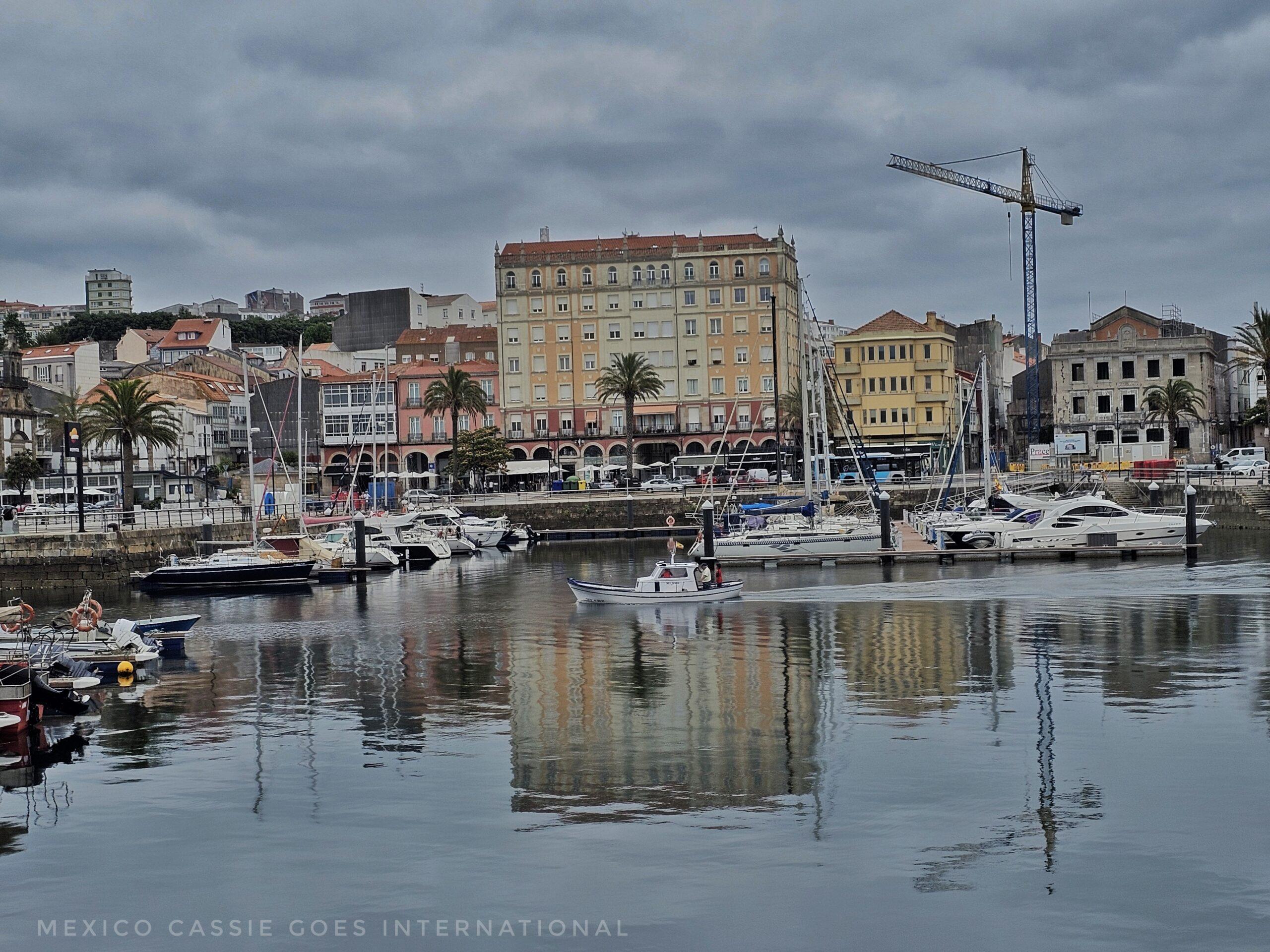 view of Ferrol from the water, boats, crane, buildings