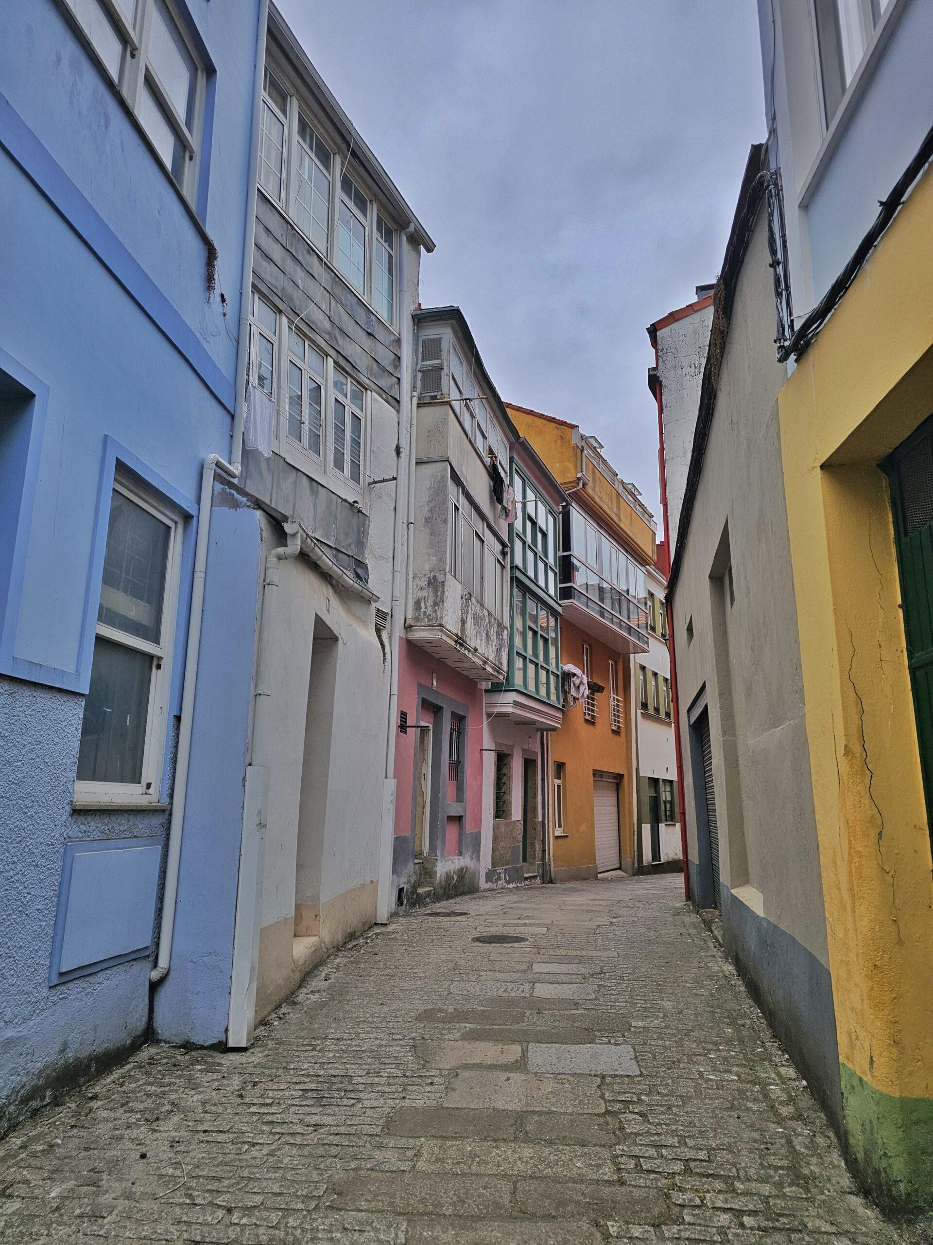narrow street with houses on both sides