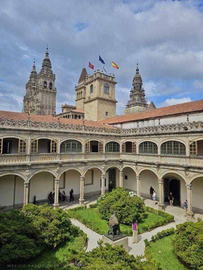 view of the cathedral of santiago from the university - you can see the towers above the cloistered hall ways