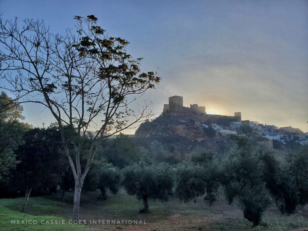castle up on a hill, dusk, wintery day
