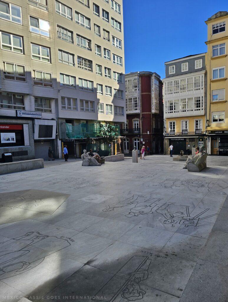 plaza with benches and drawings on ground