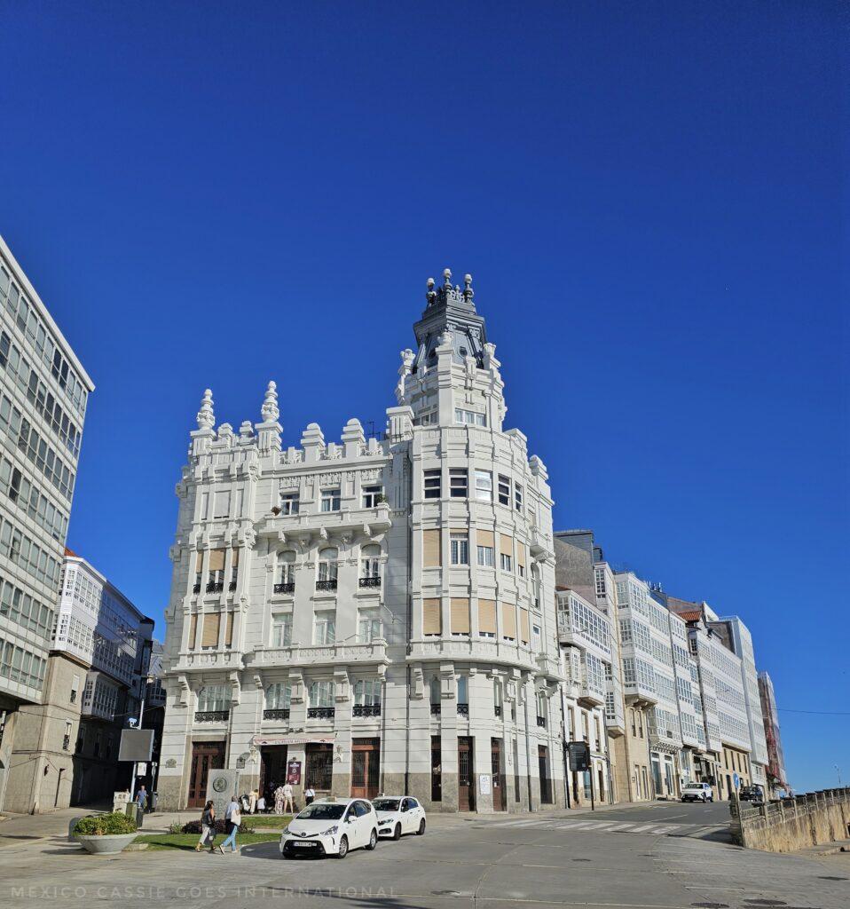 beautiful white building with tower against a perfect blue sky