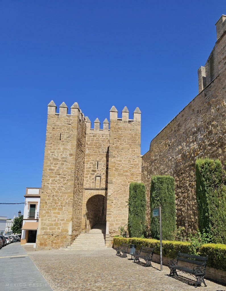 medieval wall and gate against blue sky